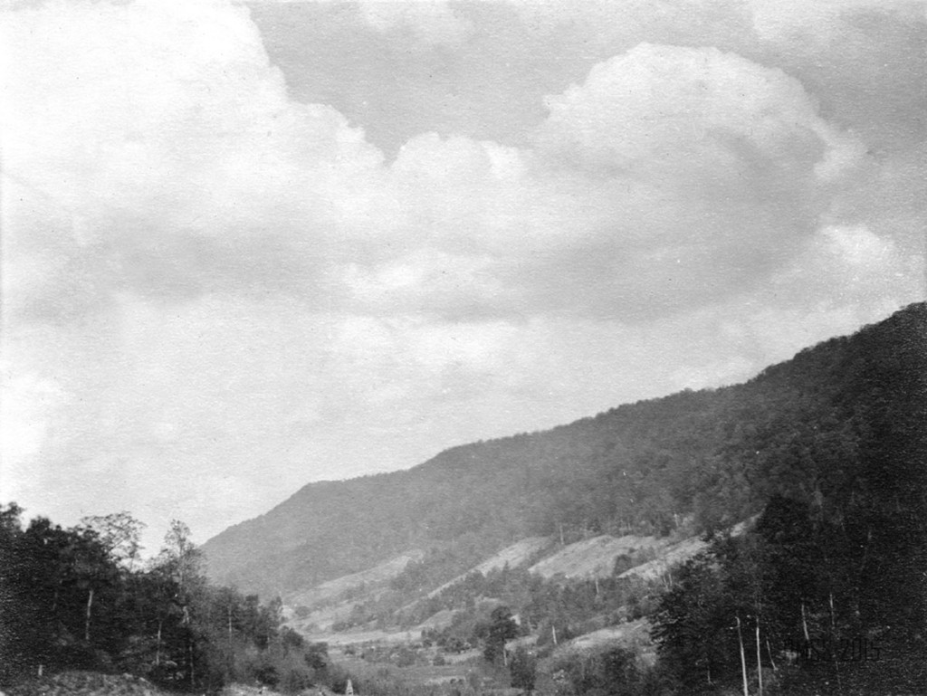 005a P. Roettinger Album. "Country [?] Looking from Uncle John's toward the School."