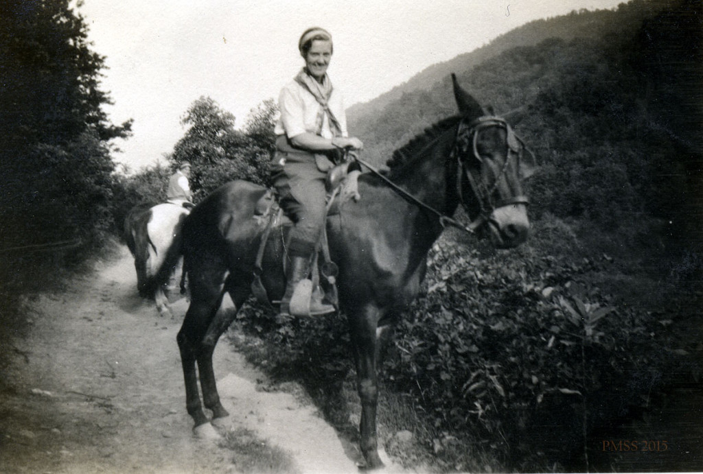 Kitty Russel riding a mule.
